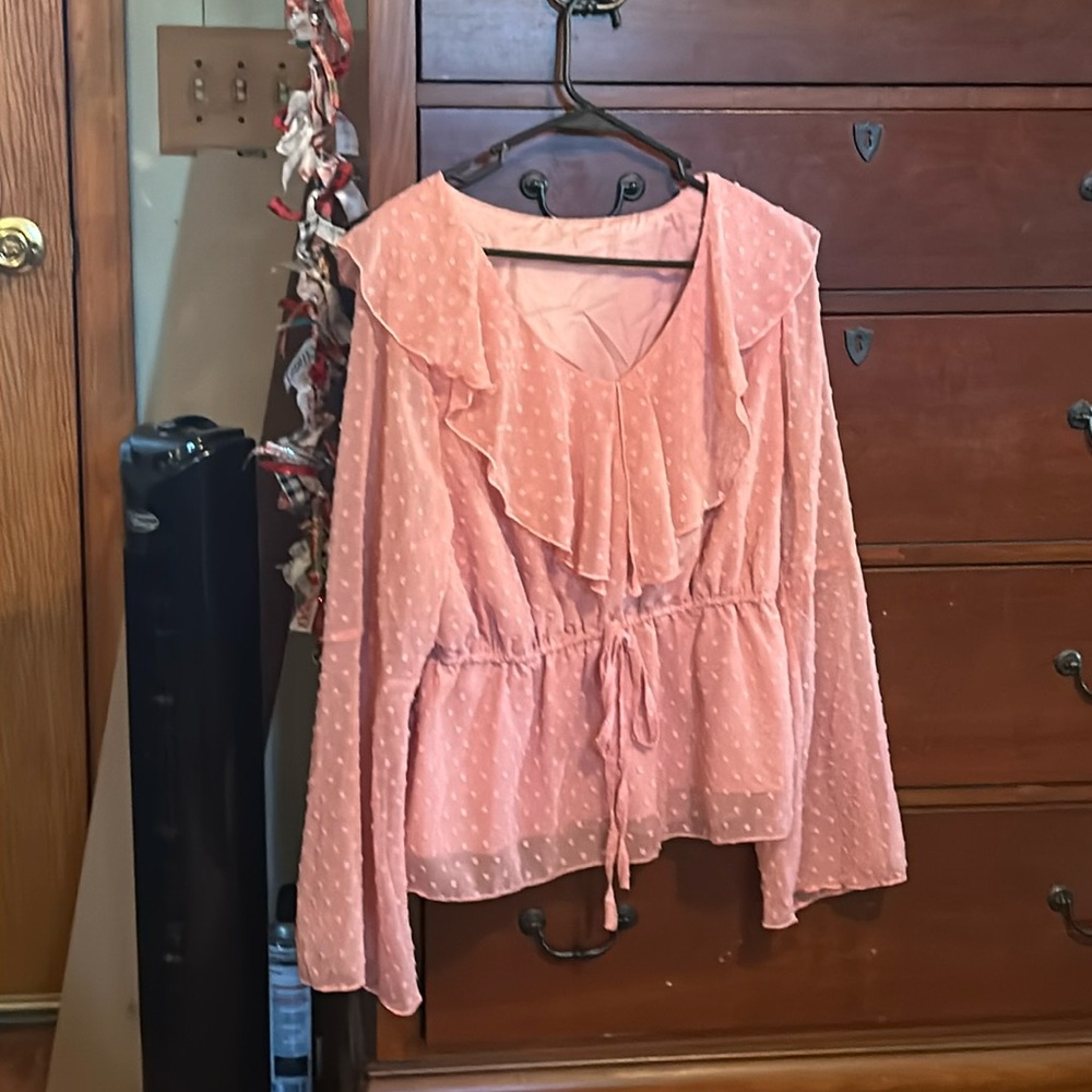 A cute Hipster top, pink, with flared sleeves and decorated with mini Pom Poms